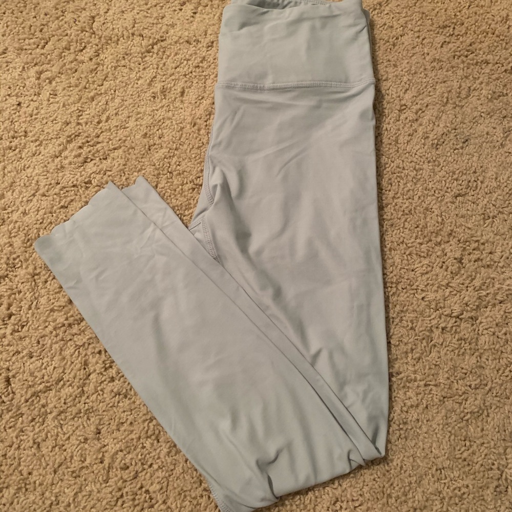 thin, light blue leggings.